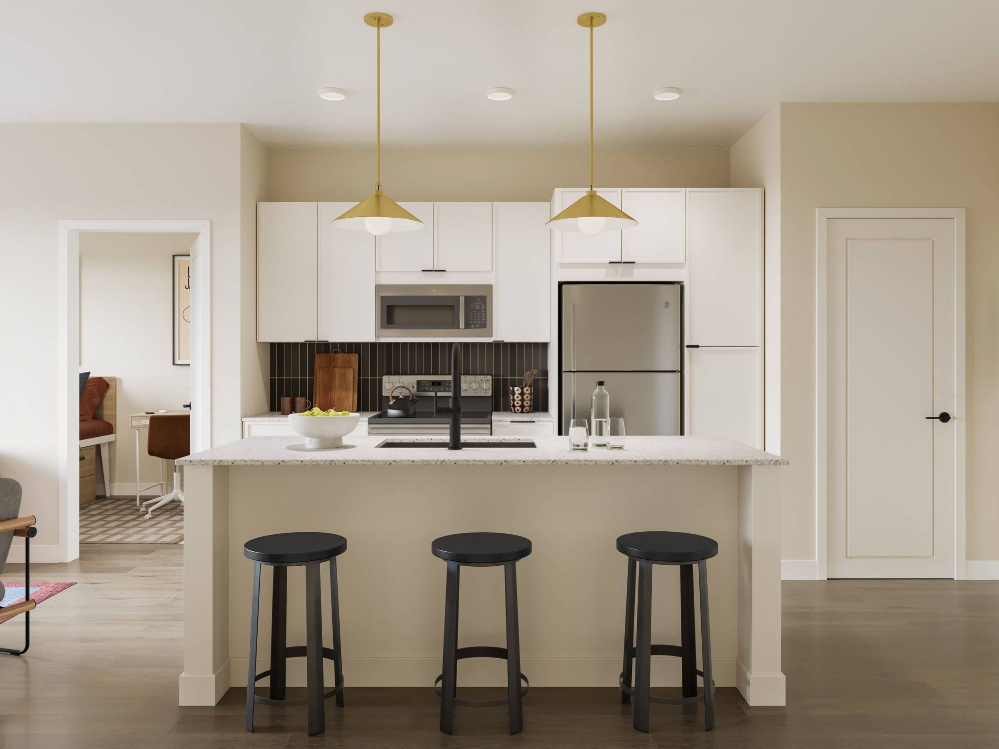 Modern kitchen with white cabinets, island with three stools, stainless steel appliances, and pendant lights.