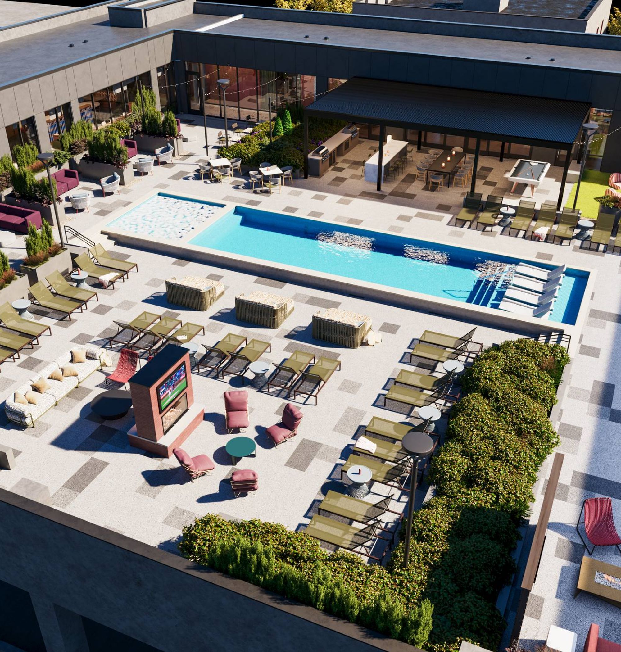 LOCAL On Delmar apartments Rooftop pool area with lounge chairs, greenery, shaded seating, and outdoor TVs in a modern building.